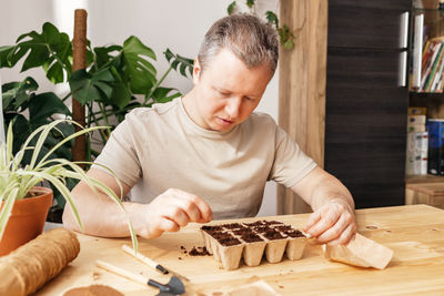 Side view of man working at home