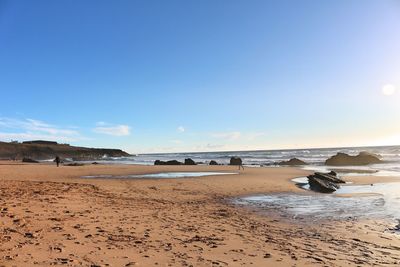 Scenic view of beach against sky