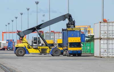 Vehicles on road against sky