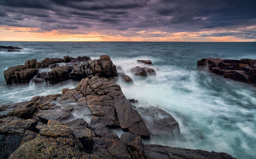 Scenic view of sea against sky during sunset