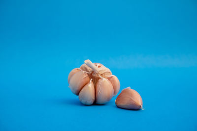 Close-up of bread on table against blue background
