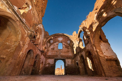 Low angle view of old building against clear sky