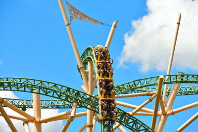 Low angle view of rollercoaster against sky