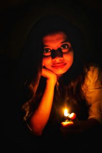 Portrait of man against black background