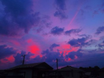 Low angle view of silhouette buildings against sky during sunset