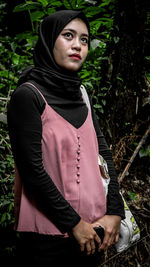 Portrait of beautiful young woman wearing mask