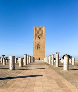 Low angle view of historical building against clear blue sky
