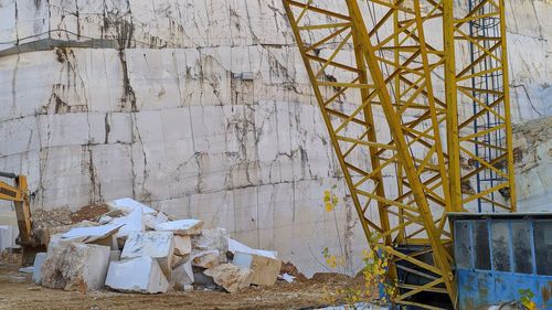 Abandoned construction site by wall