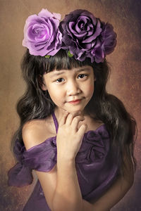 Portrait of cute girl with pink flower