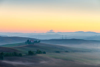 Scenic view of landscape against sky during sunset