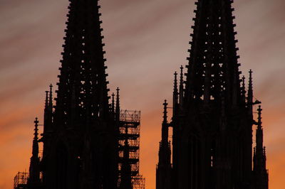 Skyscrapers against sky during sunset