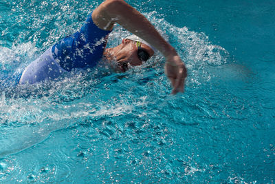 Man swimming in pool