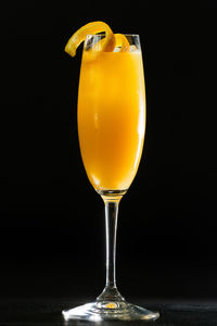 Close-up of drink on table against black background