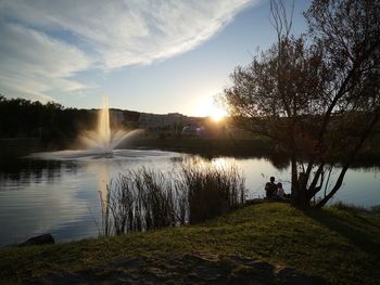 Scenic view of lake against sky during sunset