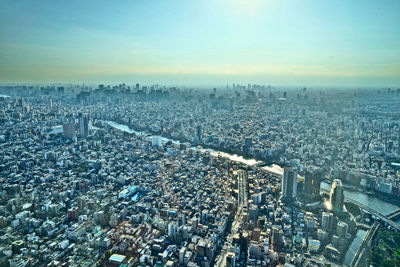 High angle view of city buildings against sky