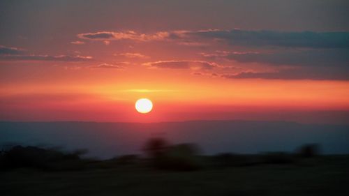 Scenic view of silhouette landscape against sky during sunset