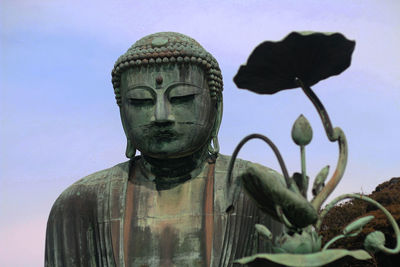 Close-up of statue against sky