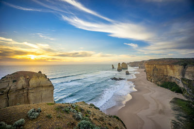 Scenic view of twelve apostles against sky during sunset