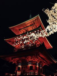 Low angle view of firework display at night