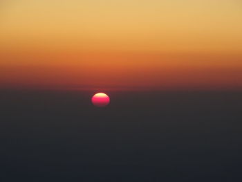 View of moon at sunset