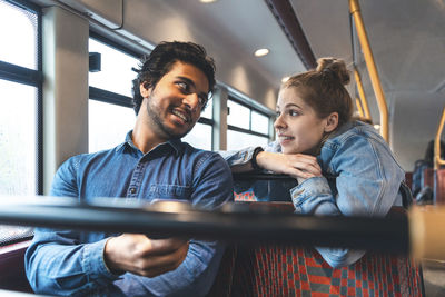 Friends travelling together by bus, london, uk