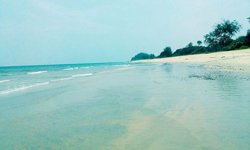 Scenic view of sea against blue sky