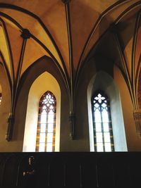 Low angle view of building seen through window
