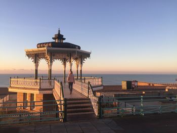 View of pier on sea during sunset