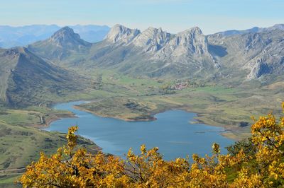 Scenic view of lake and mountains against sky