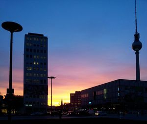 Low angle view of modern buildings against sky at night