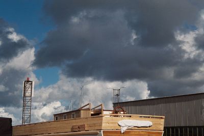 Low angle view of smoke stack against sky
