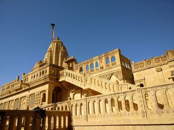 Low angle view of historic building against clear sky