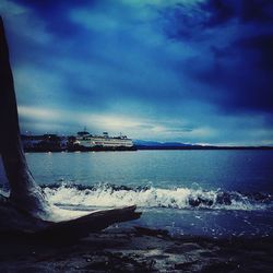 Scenic view of sea against cloudy sky