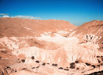 View of desert against mountain range