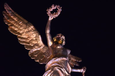 Close-up of lamp over black background