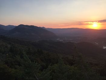 Scenic view of mountains against sky during sunset