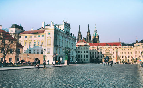 Group of people in front of buildings in city
