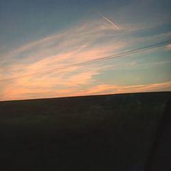 Scenic view of landscape against sky at sunset