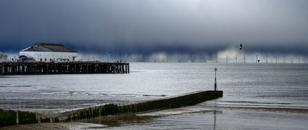 Pier over sea against sky