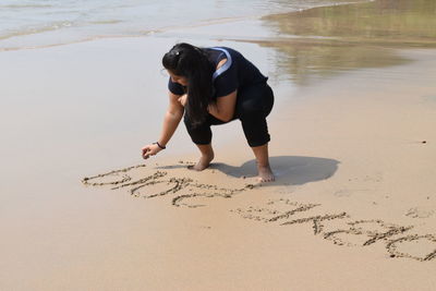 Full length of woman on beach