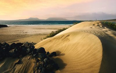 Coastal landscape scenery of sand dunnes, del risco beach, la graciosa in distance at lanzerote