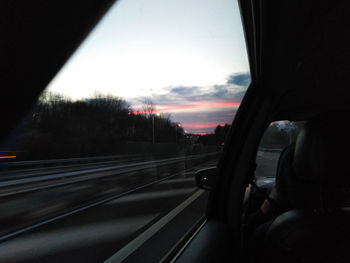 Road seen through car window