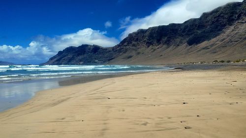 Scenic view of beach against sky