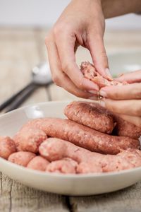 Close-up of person preparing food on table