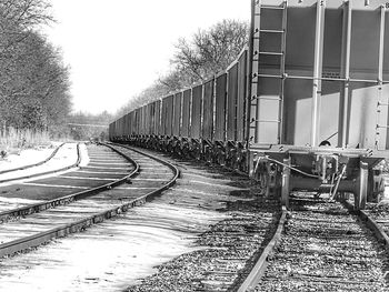 View of railway tracks along trees