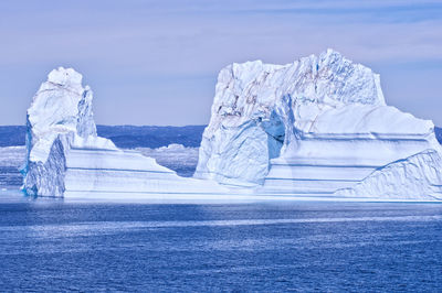 Scenic view of frozen sea against sky