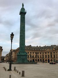 Monument against cloudy sky