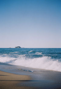 Scenic view of sea against clear sky