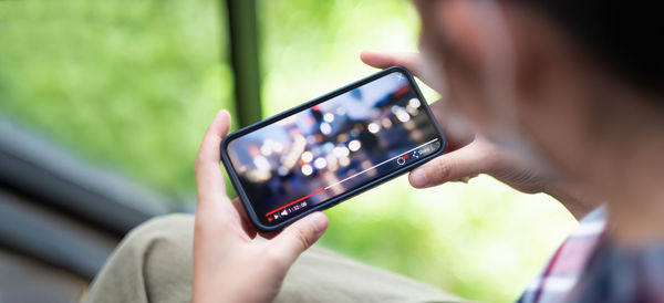 Close-up of man using mobile phone