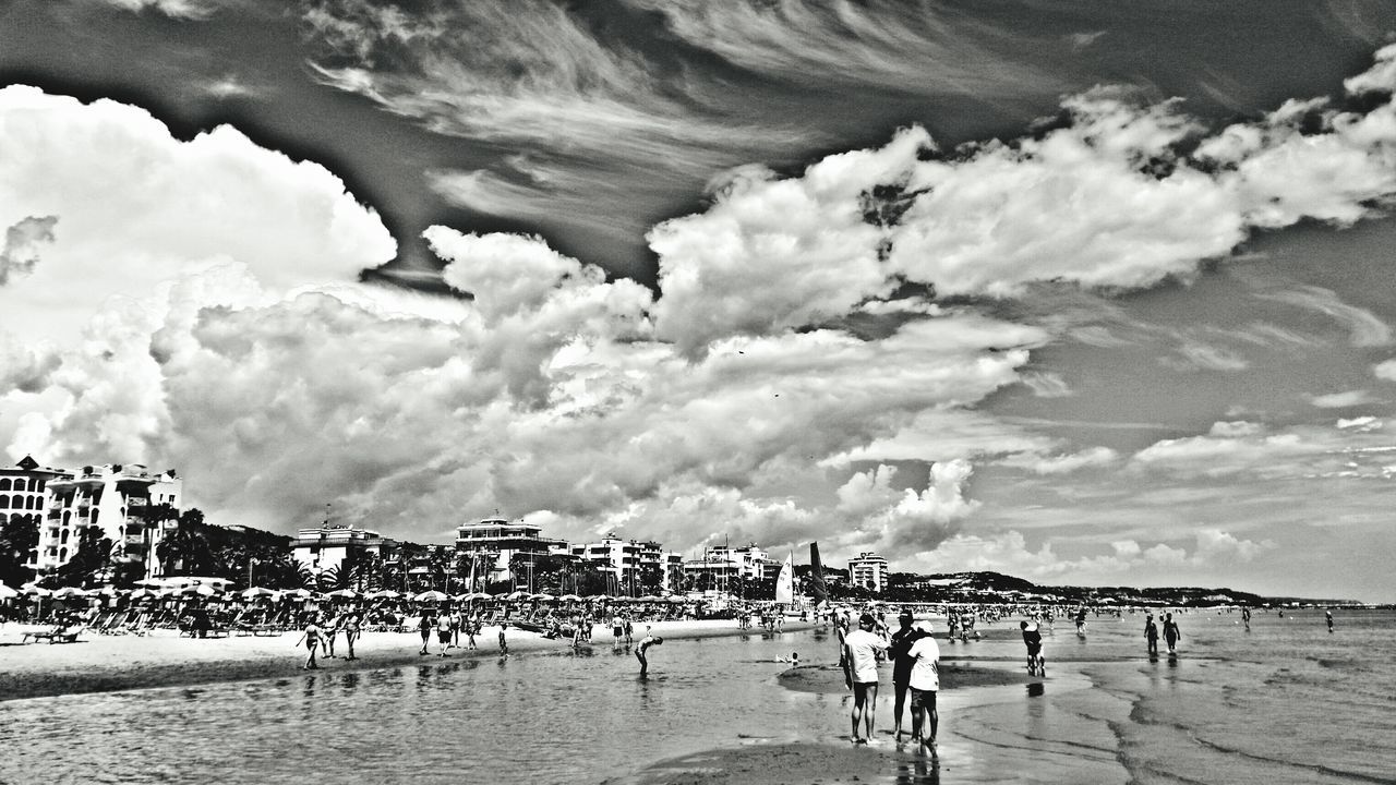 sea, beach, sky, water, cloud - sky, sand, shore, nature, vacations, cloudy, scenics, tranquility, lifestyles, leisure activity, day, tranquil scene, cloud, large group of people, horizon over water